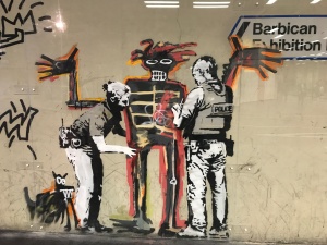 Banksy's Portrait of Basquiat being welcomed by the Metropolitan Police - an (unofficial) collaboration with the new Basquiat show.